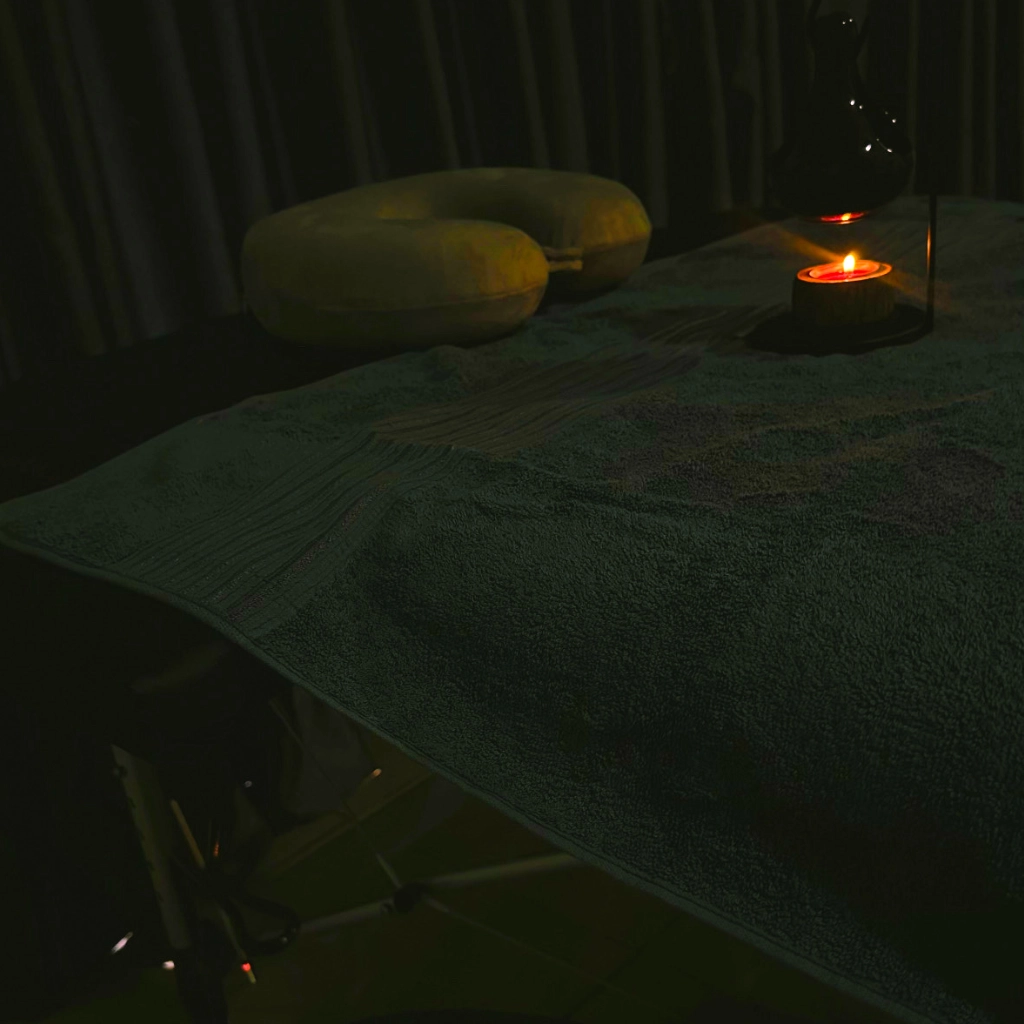 Spa therapist preparing a calm setup in a luxurious room